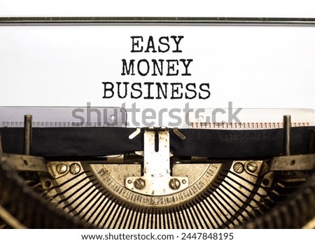 Easy money business symbol. Concept words Easy money business typed on beautiful old retro typewriter. Beautiful white paper background. Easy money business concept. Copy space.