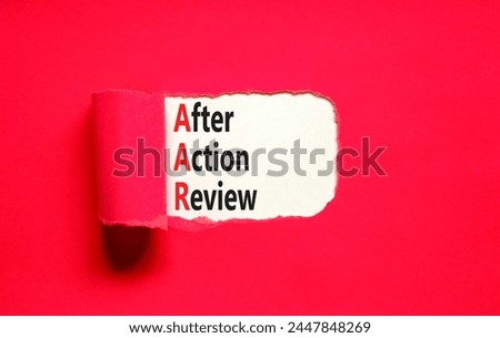 AAR After action review symbol. Concept words AAR After action review on beautiful white paper. Beautiful red paper background. Business AAR after action review concept. Copy space.