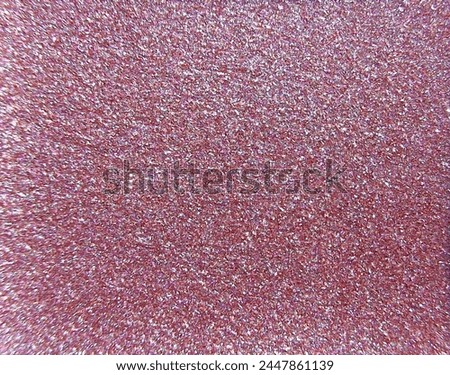 A close-up of one color of gel glitter from a multi-color cartridge. We see individual sparkles and various reflections of light. Royalty-Free Stock Photo #2447861139