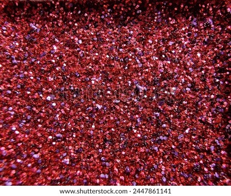 A close-up of one color of gel glitter from a multi-color cartridge. We see individual sparkles and various reflections of light. Royalty-Free Stock Photo #2447861141