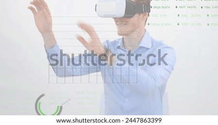 Image of financial data processing over businessman using vr headset. global business, connections, digital interface and technology concept digitally generated image.