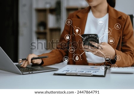 Copyright or patent concept, Person hand using laptop computer, tablet and smartphone with virtual screen copyright icon trademark, Creation ownership against piracy at office. 