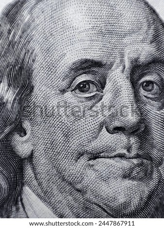 Macro photograph of Benjamin Franklin's face.  100 dollar bill.  Benjamin Franklin.
