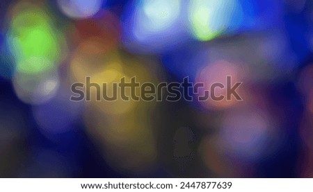 Defocused neon light. Overlaying highlights. Colored bokeh. Futuristic LED lighting. Blur of colors on dark abstract background