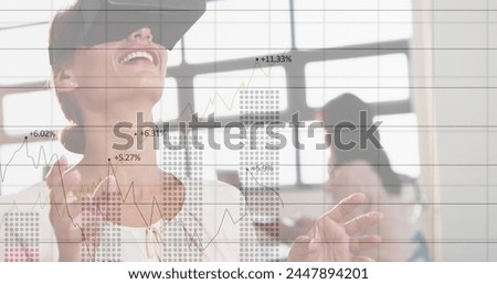 Image of financial data processing over business people using vr headsets. global business, connections, digital interface and technology concept digitally generated image.