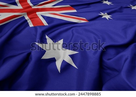 waving colorful national flag of australia. macro shot