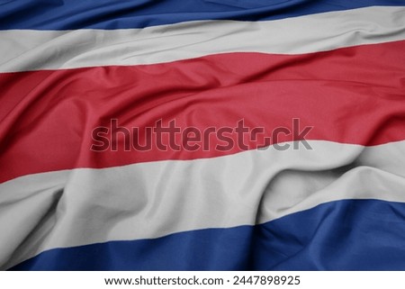 waving colorful national flag of costa rica. macro shot