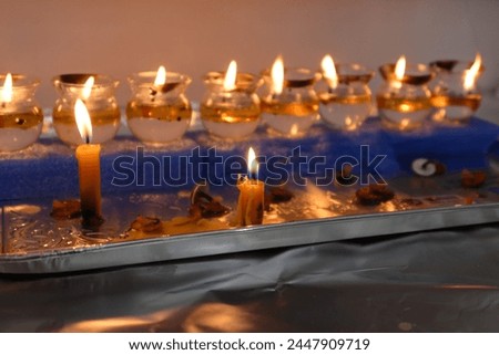Hanukkah candles, a Jewish holiday celebrated in December. (To the editor, it is written in Hebrew - these candles are holy)