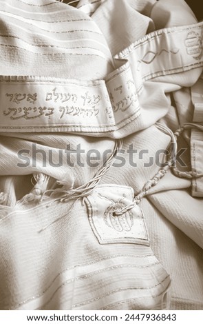 translation:Blessed are You, L-rd our G‑d, King of the universe, who has sanctified us with His commandments, and commanded us to enwrap ourselves in Tzitzit. Royalty-Free Stock Photo #2447936843