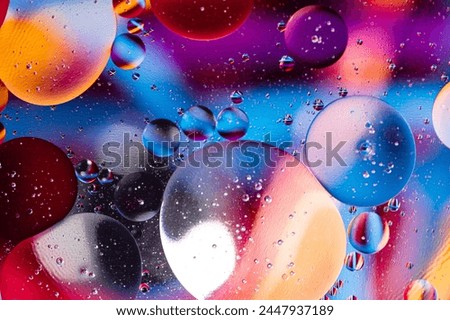 Macro photography of oil bubbles dissolved in water. Colorful background.
