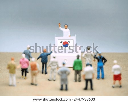 Mini toy of action figure at table with blurred background. Toy photography concept.