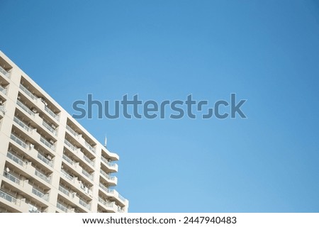 Cloudless blue sky and city buildings