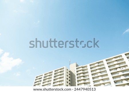 Cloudless blue sky and city buildings