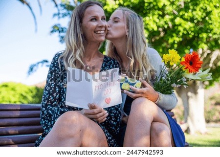 Daughter kisses her mother during Mother's day.
