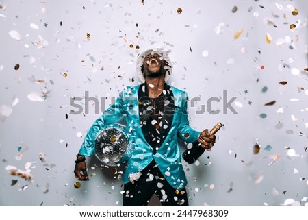 portrait of an hip hop music musician. Cinematic image of a man under confetti drop