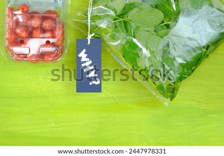 plastic wrapped food, spinach and tomatoes in plastic bags,sign with caption Why? Environmental conservation, avoiding plastic packaging concept