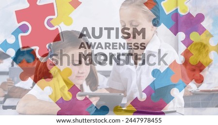 Image of autism awareness month text over diverse schoolchildren using tablet. autism awareness month and celebration concept digitally generated image. Royalty-Free Stock Photo #2447978455