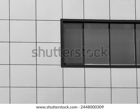 Contemporary Facade Design. Square Pattern and Window Frames in Modern Building Wall. Monochrome , detail. Black and white, contrast.