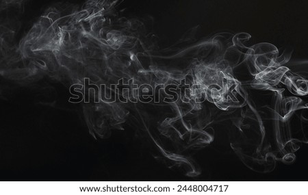 Gas white smoke swirls isolated on black studio background