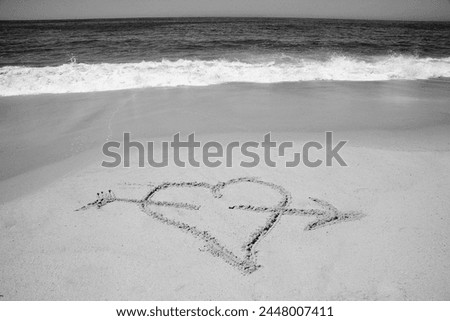 Heart. Heart drawn on sand of a tropical beach at sunset. Clear turquoise ocean. Laguna Beach California. Words written in sand. Happy Valentines Day. Words of Love. Love Symbol. I love you. True Love