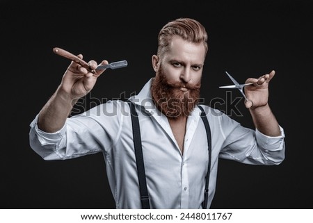 Haircut at hairdresser man. Barber making hairstyle. Advertising for barbershop. Hairdressing skills of man. Retro hairdresser holding razor and scissors isolated on black. Hairstylist serving Royalty-Free Stock Photo #2448011767