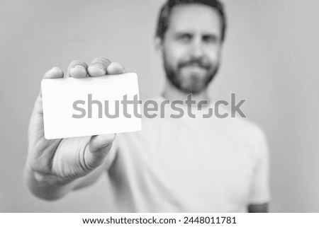 selective focus photo of blank credit card with laptop. blank credit card isolated on yellow.