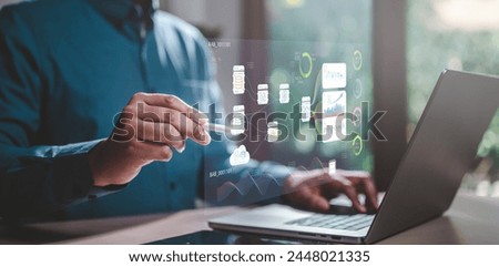 chart, diagram, graph, intelligence, marketing, analysis, report, connection, innovation, network. A man is using a laptop to draw a graph on a screen. Concept of technology and data visualization.