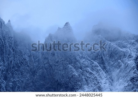 Trollveggen mountains in winter (Norway). Royalty-Free Stock Photo #2448025445