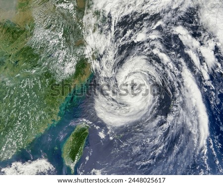 Typhoon Nari 20W off the coast of China and Taiwan. Typhoon Nari 20W off the coast of China and Taiwan. Elements of this image furnished by NASA. Royalty-Free Stock Photo #2448025617