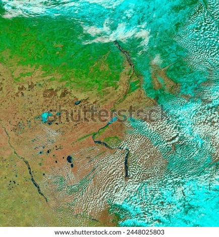Flooding in Southern Siberia. Springtime flooding in southern Siberia is not unusual. Melting snow fills the northflowing rivers in the south. Elements of this image furnished by NASA. Royalty-Free Stock Photo #2448025803