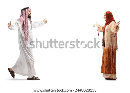 Full length profile shot of a saudi arab man meeting a woman wearing hijab isolated on white background Royalty-Free Stock Photo #2448028153