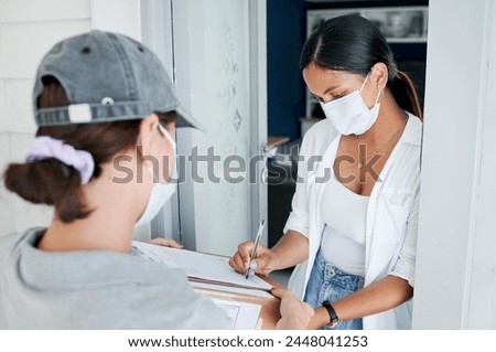 Woman, signing and delivery with box for order, shipment or ecommerce by door at home. Female person or customer writing signature with courier service and face mask for cargo, parcel or package