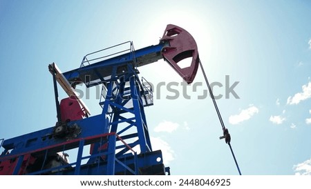oil business. oil pump pumps out of the ground resource extraction. industry business oil and gas concept. energy rig petroleum barrel concept. oil pump mechanism works in production business