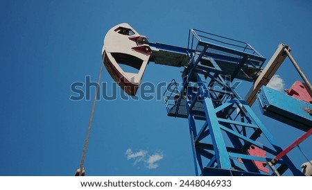 oil business. oil pump pumps out of the ground resource extraction. industry business oil and gas concept mechanism. energy rig petroleum barrel concept. oil pump works in production business