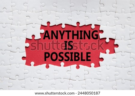 Anything is Possible symbol. White puzzle with words Anything is Possible. Beautiful red background. Business and Anything is Possible concept. Copy space.