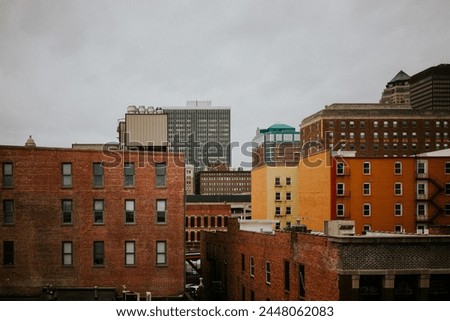 City buildings with grey sky in Des Moines