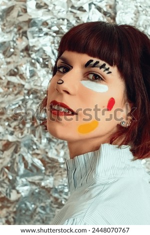 young brunette girl with colorful make up