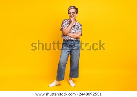 Full length photo of lovely senior lady touch chin thinking wear trendy leopard print garment isolated on yellow color background
