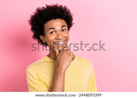 Photo of cheerful funky guy dressed yellow t-shirt arms chin empty space isolated pink color background Royalty-Free Stock Photo #2448093399