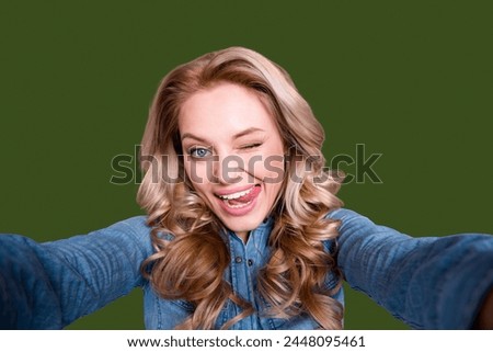 Self-portrait of her she nice cute lovely charming attractive cheerful cheery childish wavy-haired lady wearing blue shirt flirting isolated over gray violet purple pastel background