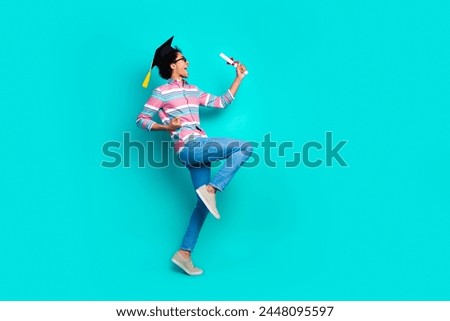 Profile side photo of glad positive man wear trendy clothes hands hold diploma empty space isolated on cyan color background