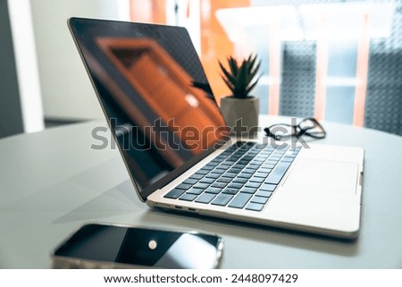 Office desk with laptop on it, glasses, decor, business concept, stock photo