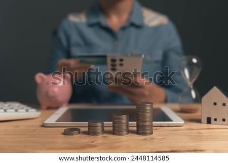 Savings from doing business. Saving money for emergency investments and future investments.Businessman checking his credit card balance