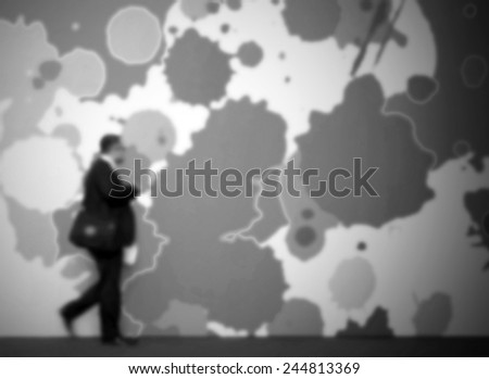 Man walk, black and white background. Intentionally blurred post production.