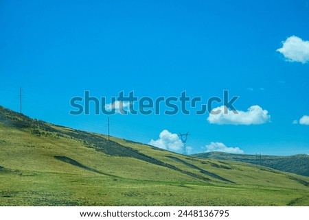 Aba Qiang and Tibetan Autonomous Prefecture, Sichuan Province - mountains and grassland scenery under the blue sky