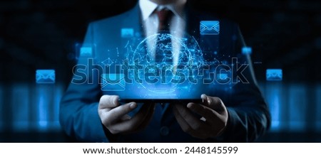 Businessman with Globe Hologram and icons: Message Email Mail Communication Online Chat Concept
