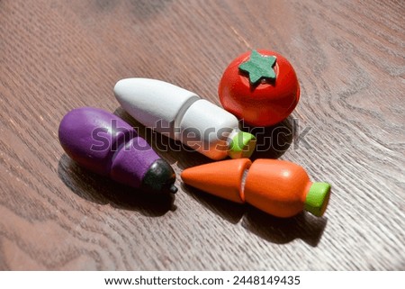 vegetable wooden toys placed on the windowsill