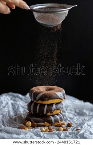 Chocolate donuts with cocoa editorial