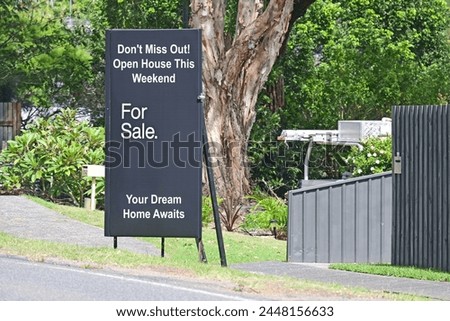 Home for sale sign with open house