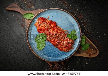 Seafood pasta. Menu for a pub on a dark background. Colorful juicy food photography.
